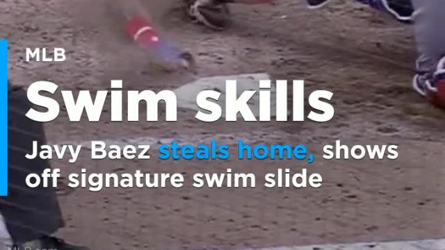 Baez steals home, shows off signature swim slide