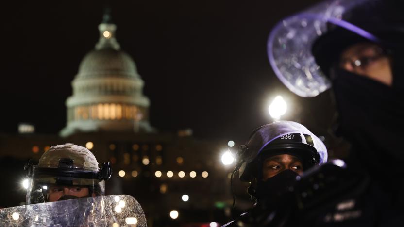WASHINGTON, DC - JANUARY 06: Members of the National Guard and the Washington D.C. police keep a small group of demonstrators away from the Capital after thousands of Donald Trump supporters stormed the United States Capitol building following a "Stop the Steal" rally on January 06, 2021 in Washington, DC. The protesters stormed the historic building, breaking windows and clashing with police. Trump supporters had gathered in the nation's capital today to protest the ratification of President-elect Joe Biden's Electoral College victory over President Trump in the 2020 election. (Photo by Spencer Platt/Getty Images)