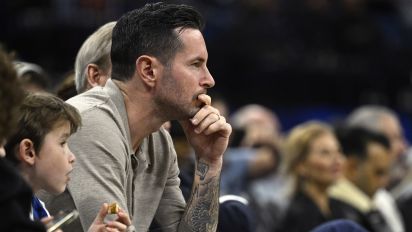 Associated Press - Former Orlando Magic guard JJ Redick, center, watches from a court side seat during the first half of an NBA basketball game, Feb. 14, 2024, in Orlando, Fla. Redick is being hired as the head coach of the Los Angeles Lakers, a person with knowledge of the decision tells The Associated Press. (AP Photo/Phelan M. Ebenhack, file)