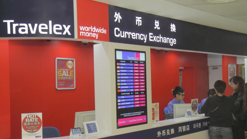 Travelex, currency exchange desk at Hong Kong International Airport. (Photo by: Jeff Greenberg/Universal Images Group via Getty Images)
