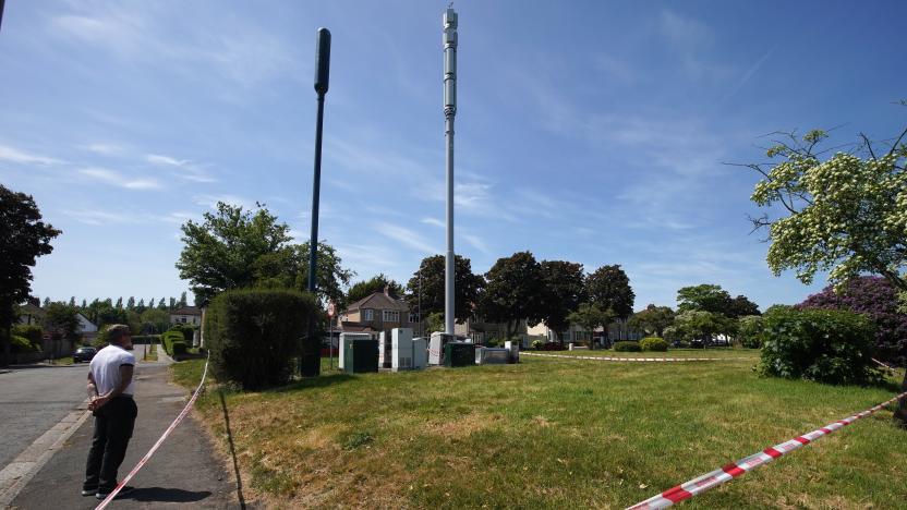 LIVERPOOL, ENGLAND - MAY 28: Fire and explosion damage can be seen on an EE network 5G mast that was attacked by an arsonist earlier this week in Brodie Avenue on May 28, 2020 in Liverpool, England. A lot of the damage was caused by the resulting explosion when the petrol was ignited. Several phone masts have been deliberately damaged around the UK, their attackers inspired by a conspiracy theory positing that 5G technology is linked to the spread of the coronavirus. (Photo by Christopher Furlong/Getty Images)