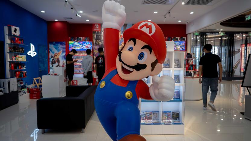 TIANJIN, CHINA - 2021/07/20: A cartoon figurine of Super Mario Bros. stands in front of a Nintendo Switch store in a shopping market.  By the end of June 2021, Nintendo's total global sales of Switch (including Switch and Switch Lite) have reached 87.43 million units, surpassing PS3 and becoming the seventh best selling host in Nintendo's history. (Photo by Zhang Peng/LightRocket via Getty Images)