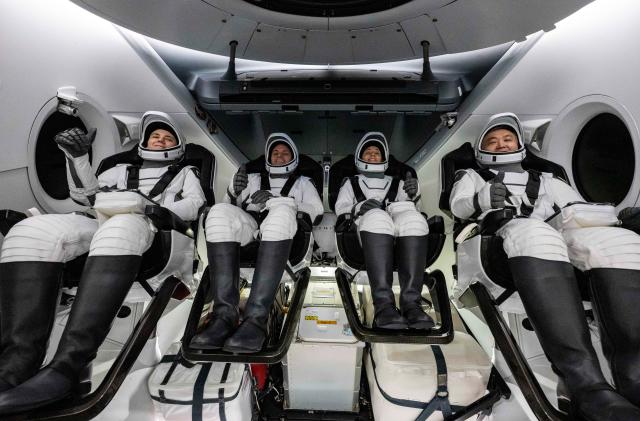 Roscosmos cosmonaut Anna Kikina, left, NASA astronauts Josh Cassada and Nicole Mann, and Japan Aerospace Exploration Agency (JAXA) astronaut Koichi Wakata, right, are seen inside the SpaceX Dragon Endurance spacecraft onboard the SpaceX recovery ship Shannon shortly after having landed in the Gulf of Mexico off the coast of Tampa, Florida, Saturday, March 11, 2023. 