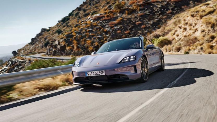 A Porsche drives along the coastal highway.