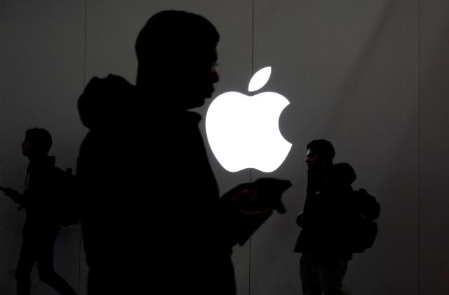 People walk past the Apple Store in the Eaton Centre in Toronto, Ontario, Canada November 22, 2022.  REUTERS/Carlos Osorio