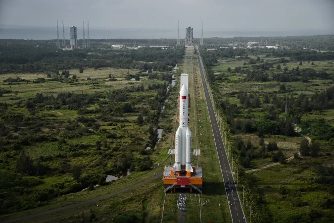 A Long March-5B carrier rocket is transported at the Wenchang Space Launch Center in Wenchang, Hainan province, China April 29, 2020. Picture taken April 29, 2020. China Daily via REUTERS ATTENTION EDITORS - THIS IMAGE WAS PROVIDED BY A THIRD PARTY. CHINA OUT.