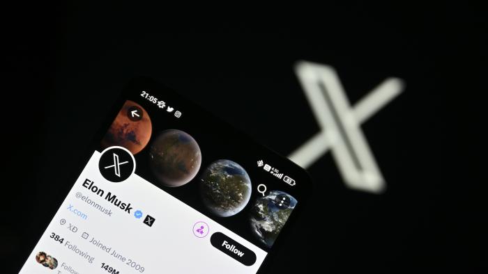 ANKARA, TURKIYE - JULY 24: In this photo illustration, Twitter account of Elon Musk is displayed in front of a screen displaying the new logo of 'Twitter' in Ankara, Turkiye on July 24, 2023. (Photo by Harun Ozalp/Anadolu Agency via Getty Images)