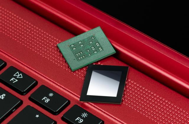 Qualcomm Snapdragon 8cx Gen 3 chipset on top of a red laptop.