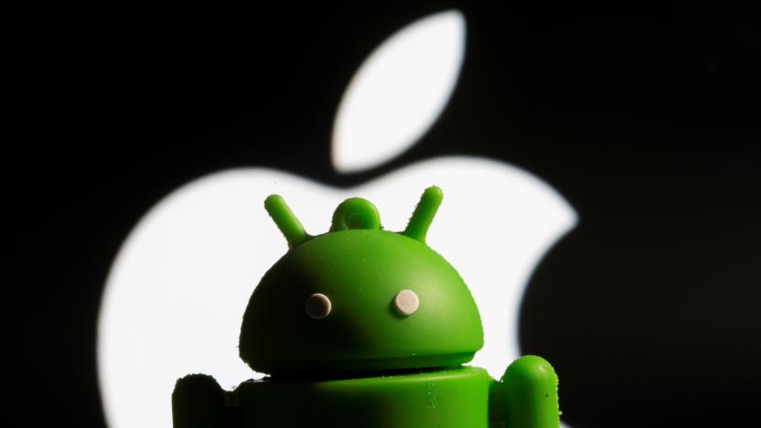 A 3D printed Android mascot Bugdroid is seen in front of the Apple logo in this illustration taken November 3, 2021. REUTERS/Dado Ruvic/Illustration