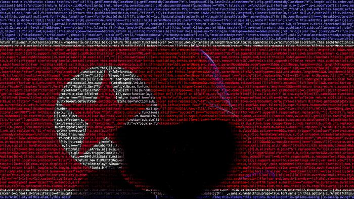 North Korean flag made from computer code with a hooded hacker shining through cybersecurity concept