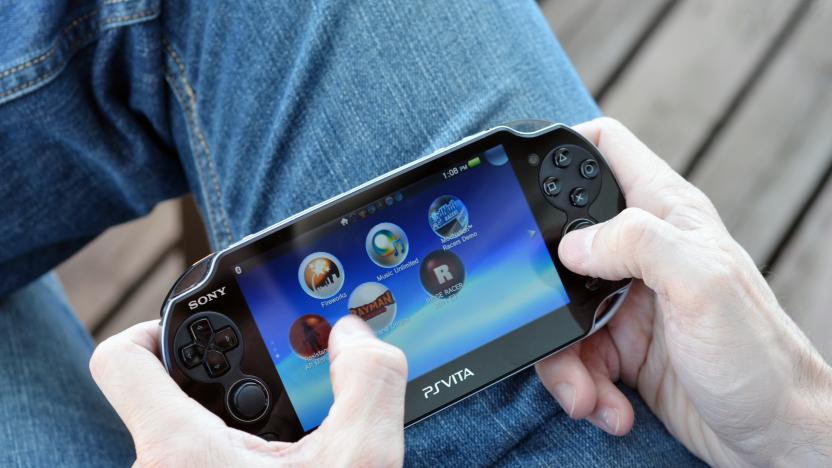 'Vancouver, Canada -- April 7, 2012: Close up of a man playing on a PS Vita video game system. The PS Vita is a newest portable gaming console from Sony.'