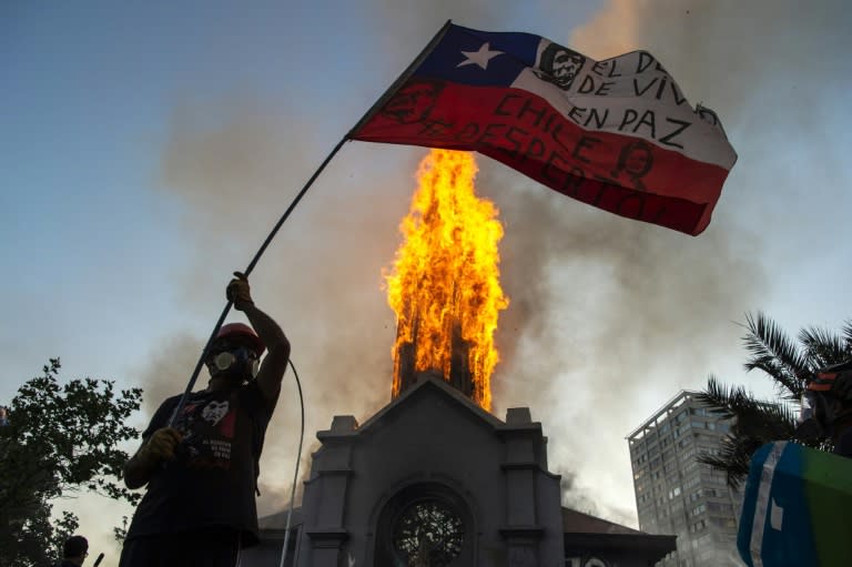 Churches burned as thousands mark Chile protest movement anniversary