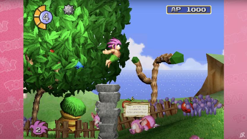 a still from the PS1 game Tomba showing a shirtless boy with pink hair and green shorts jumping off a rock platform. A clothed pig lays on the ground in front of him. There is a lush green tree in the background and grass with purple growths sprouting upward