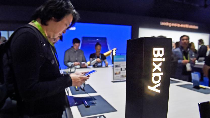 LAS VEGAS, NEVADA - JANUARY 08:  Attendees examine Bixby enabled devices at the Samsung booth during CES 2019 at the Las Vegas Convention Center on January 8, 2019 in Las Vegas, Nevada. CES, the world's largest annual consumer technology trade show, runs through January 11 and features about 4,500 exhibitors showing off their latest products and services to more than 180,000 attendees. (Photo by )