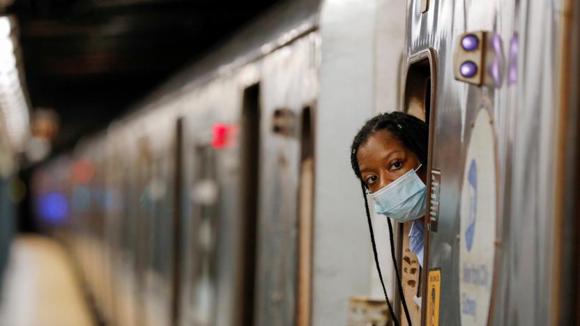An MTA worker is seen wearing a mask on the subway after The Port Authority of New York and New Jersey and the Metropolitan Transportation Authority (MTA) announced a mandatory coronavirus vaccination or weekly test mandate for employees in New York City, New York, U.S., August 2, 2021. REUTERS/Andrew Kelly