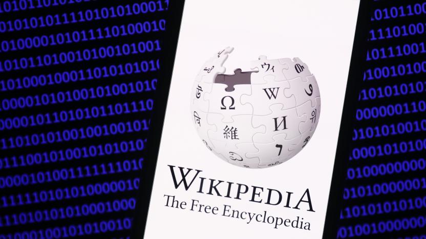 Wikipedia logo displayed on a phone screen and a binary code displayed on a screen are seen in this illustration photo taken in Krakow, Poland on January 19, 2023. (Photo by Jakub Porzycki/NurPhoto via Getty Images)