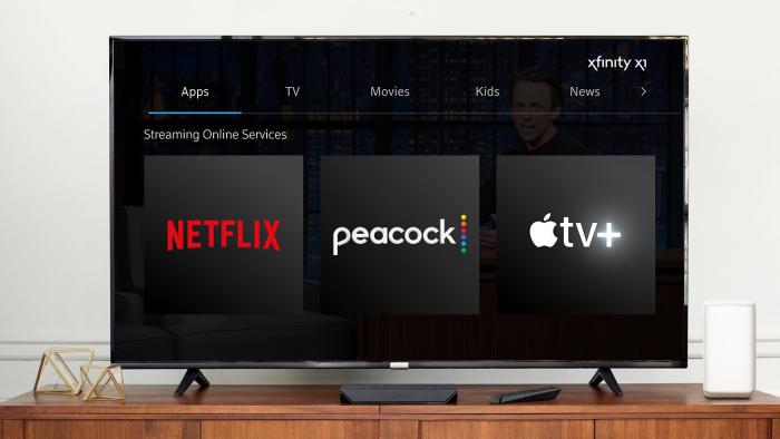 A TV showing the logos for Netflix, Peacock and Apple TV+.
