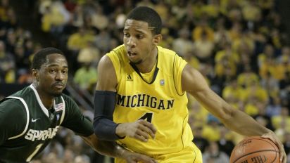 Associated Press - Michigan guard Darius Morris (4) is pressured by Michigan State guard Kalin Lucas (1) while bringing the ball up court in the second half of a NCAA college basketball game Saturday, March 5, 2011, in Ann Arbor, Mich. (AP Photo/Duane Burleson)