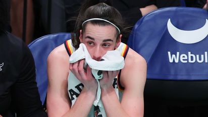 Getty Images - BROOKLYN, NY - JUNE 02: Caitlin Clark #22 of the Indiana Fever puts a towel up to her face on the bench during the first quarter of the Commissioners Cup WNBA game against the New York Liberty on June 2, 2024 at the Barclayys Center in Brooklyn, New York.  (Photo by Rich Graessle/Icon Sportswire via Getty Images)