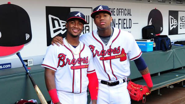 Albies embraces Acuna in dugout, 07/29/2018