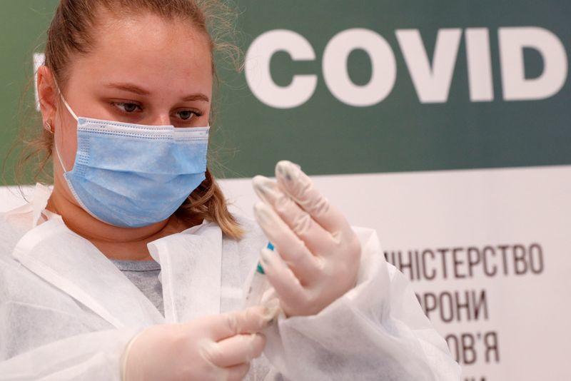 As COVID-19 toll surges, Ukraine cracks down on fake vaccination certificates
