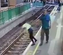 Shocking moment man pushes woman onto train tracks in Hong Kong