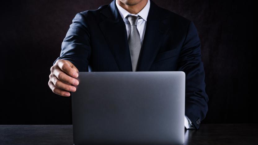 This is a photograph of businessman using laptop computer