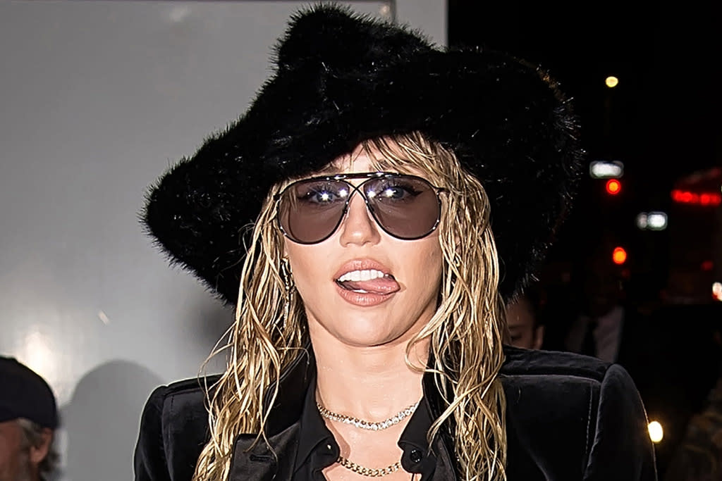 Miley Cyrus Channels the 1980s in Metallic Leggings & Bright Blue Boots ...