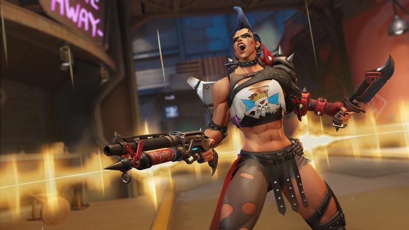 Overwatch 2 screenshot showing the Junker Queen (dressed in apocalyptic battle gear) screaming while blazing a gun and holding a knife.