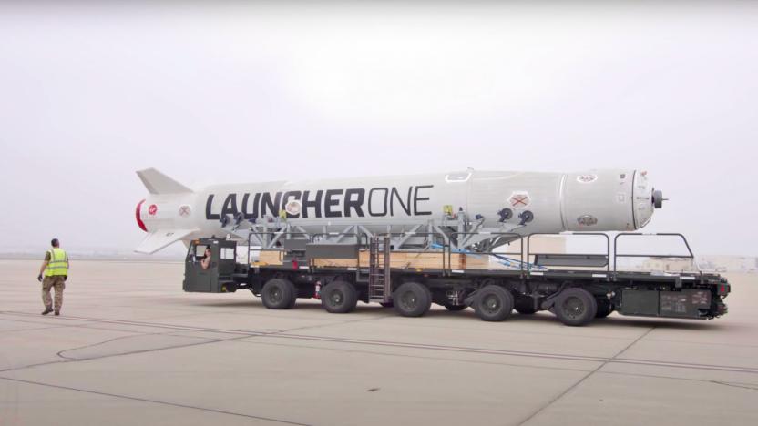 The Launcher One rocket for Virgin Orbit's 'Start Me Up' mission is seen on a runway aboard a wheeled carrier.