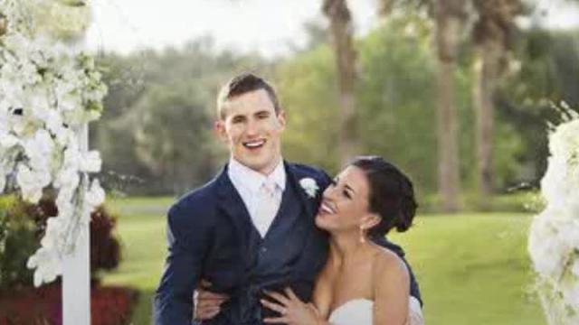 Paralyzed college football player walks down aisle at his wedding