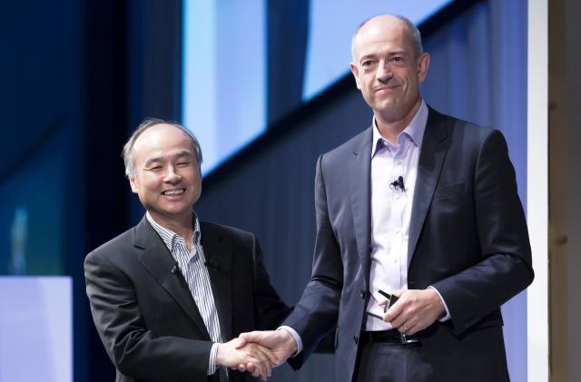 TOKYO, JAPAN - JULY 20:  SoftBank Group Corp. Chief Executive Officer Masayoshi Son, left, shakes hands with ARM Holdings Plc Chief Executive Officer Simon Segars during the SoftBank World 2017 conference on July 20, 2017 in Tokyo, Japan. With 70 speeches and sessions, the annual business event hosted by SoftBank, Japan's multinational telecommunications and internet company, takes place for 2 days until July 21. (Photo by Tomohiro Ohsumi/Getty Images)