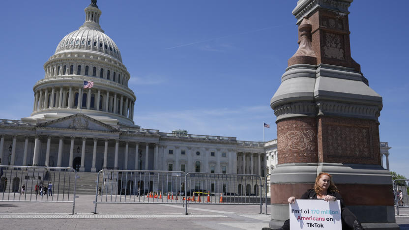 Jennifer Gay, a TikTok content creator, sits outside the U.S. Capitol, Tuesday, April 23, 2024, in Washington as Senators prepare to consider legislation that would force TikTok’s China-based parent company to sell the social media platform under the threat of a ban, a contentious move by U.S. lawmakers. (AP Photo/Mariam Zuhaib)