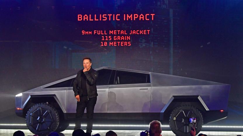 Tesla co-founder and CEO Elon Musk discusses ballistic impact in front of the newly unveiled all-electric battery-powered Tesla Cybertruck at Tesla Design Center in Hawthorne, California on November 21, 2019. 