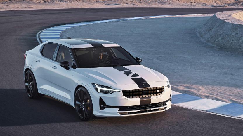 The Polestar 2 BST edition 270 in white turns a sharp corner on a raceway.