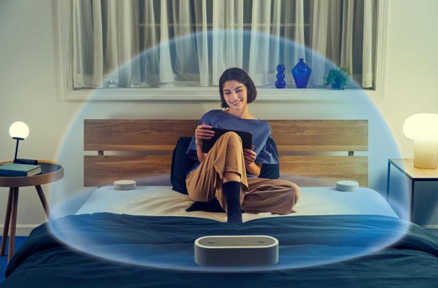 A lady in a bubble of sound created by Sony speakers. 