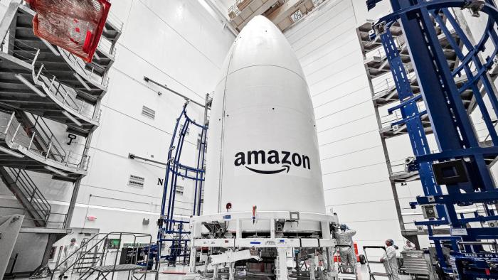 A white rocket payload with the Amazon logo.