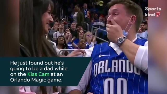 Wife uses kiss cam to make pregnancy announcement to her husband