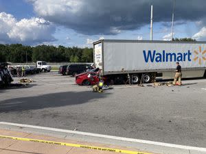 2 die when Tesla crashes into parked tractor-trailer in Florida