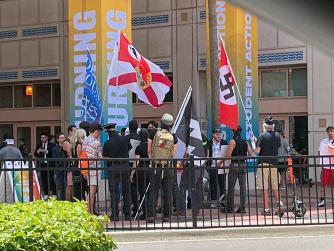 Nazi flags displayed outside Turning Point USA summit attended by Trump condemne..