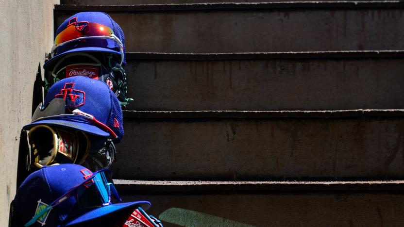 Apr 1, 2022; Scottsdale, Arizona, USA; General view of Texas Rangers hats and gloves prior to the game against the San Francisco Giants at Scottsdale Stadium. Mandatory Credit: Matt Kartozian-USA TODAY Sports