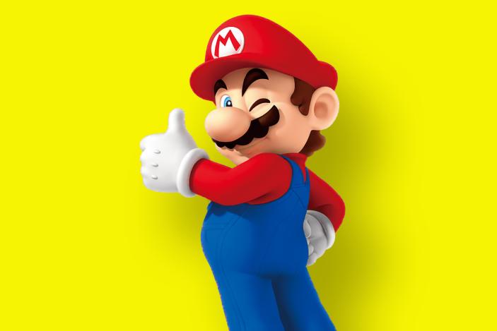 Nintendo's Mario winking with a thumbs up as he faces the camera. Yellow background with subtle drop shadow.