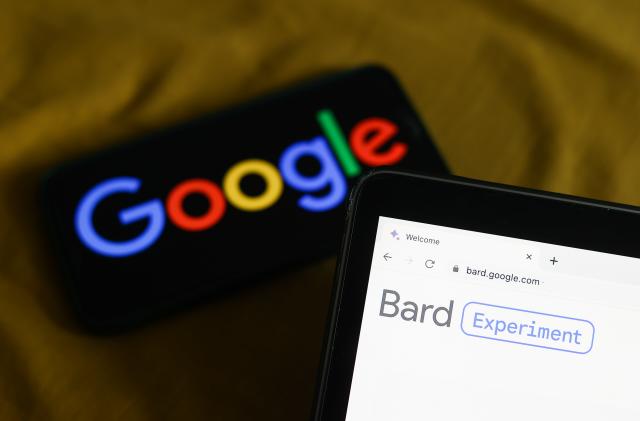 Google logo displayed on a phone screen and Bard website displayed on a laptop screen are seen in this illustration photo taken in Krakow, Poland on March 21, 2023. (Photo by Jakub Porzycki/NurPhoto via Getty Images)