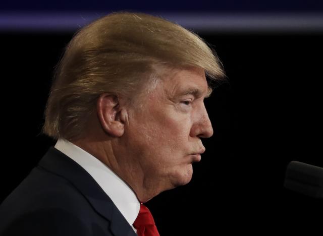 Donald Trump listens to Hillary Clinton during the third presidential debate at UNLV in Las Vegas, Wednesday, Oct. 19, 2016. (Photo: Patrick Semansky/AP)