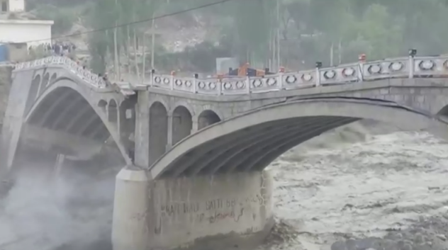 Dramatic footage shows enormous bridge crumbling amid raging floodwaters