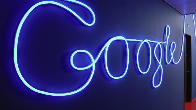 A hallway decorated with an illuminated Google logo.                                    
