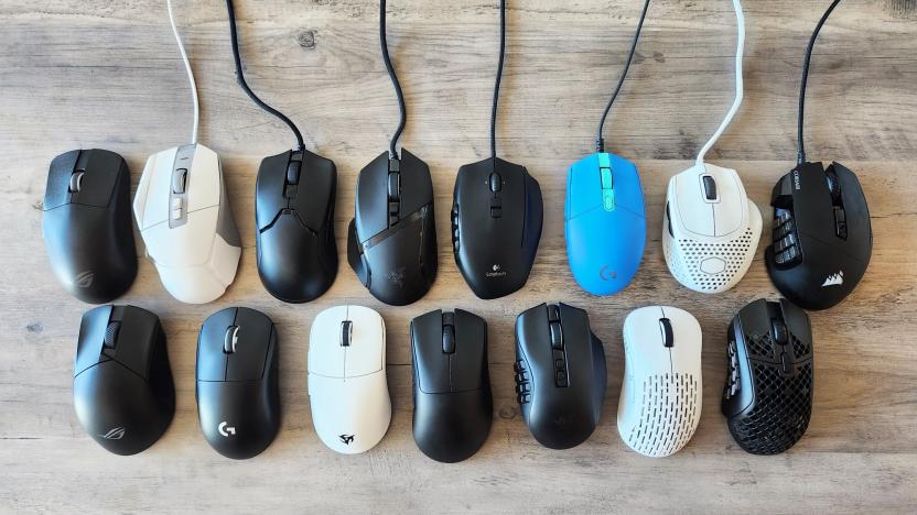 A collection of the gaming mice we tested for our buying guide, neatly laid out on a brown wooden table.