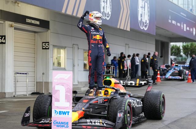 File photo taken on Oct. 9, 2022 shows Red Bull Racing's Dutch driver Max Verstappen celebrates for claiming the champion during the race of the Formula One Japan Grand Prix held at the Suzuka Circuit in Suzuka City, Japan. Red Bull's Verstappen won the F1 Japanese Grand Prix to seal the 2022 F1 Drivers' World Championship title ahead of schedule. He then took a record 14th win in a single Formula 1 season with victory in the Mexico City Grand Prix, surpassing Michael Schumacher and Sebastian Vettel's joint record of 13. With his win in the Abu Dhabi finale, Verstappen's single-season winning record was finally set at 15. (Photo by Zhang Xiaoyu/Xinhua via Getty Images)