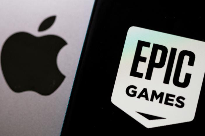 FILE PHOTO: Smartphone with Epic Games logo is seen in front of Apple logo in this illustration taken, May 2, 2021. REUTERS/Dado Ruvic/Illustration/File Photo