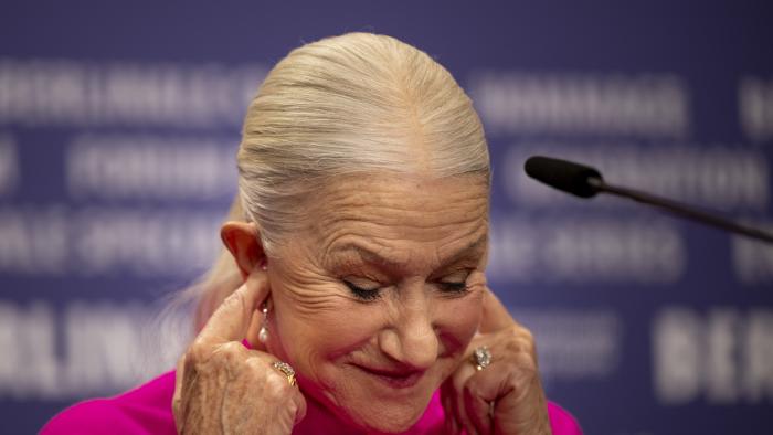 20 February 2023, Berlin: British actress Helen Mirren covers her ears at the press conference for the film "Golda". The film is screening in the Berlinale Special Gala section. The 73rd International Film Festival will take place in Berlin from Feb. 16-26, 2023. Photo: Monika Skolimowska/dpa (Photo by Monika Skolimowska/picture alliance via Getty Images)